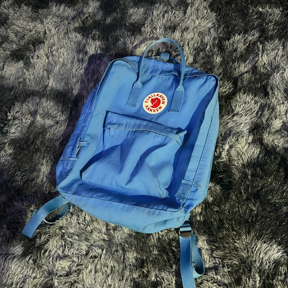 It is blue and a lot of stuff. Just let me know if you wanna buy it.